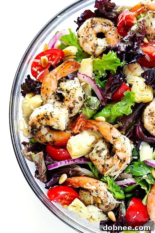 Experience the vibrant flavors of our Shrimp and Artichoke Green Salad, featuring succulent Italian-herb shrimp, tender artichoke hearts, ripe tomatoes, toasted pine nuts, all brought together with a bright, zesty lemon vinaigrette. An absolute favorite for any occasion!