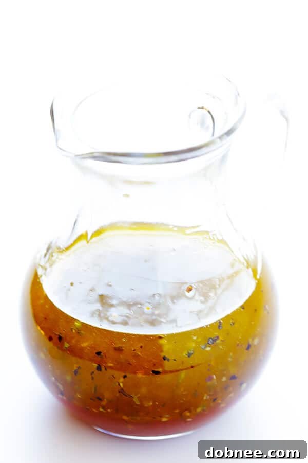 A vibrant close-up of the fresh ingredients for the Shrimp and Artichoke Green Salad: juicy tomatoes, green spring mix, and tender artichoke hearts, ready to be tossed with the homemade lemon vinaigrette and Italian-herb shrimp. A picture of healthy, delicious dining.