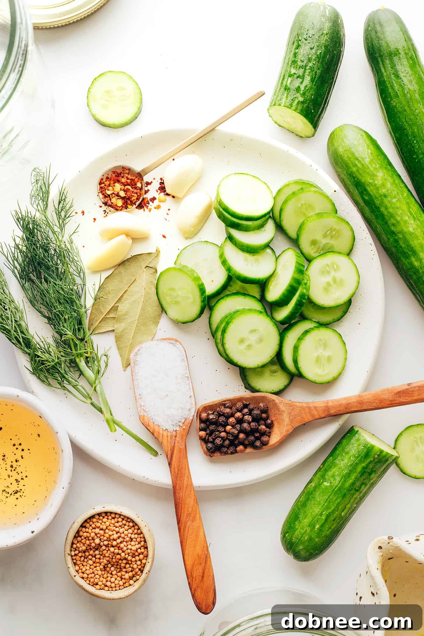 Ingredients for homemade pickles laid out on a table