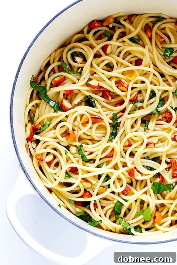 Zesty Lemon Basil Spaghetti with Almonds – a quick, easy, and healthy pasta dish featuring fresh herbs, vibrant lemon, and a delightful crunch from toasted Blue Diamond Almonds. Perfect for a protein-packed meal!