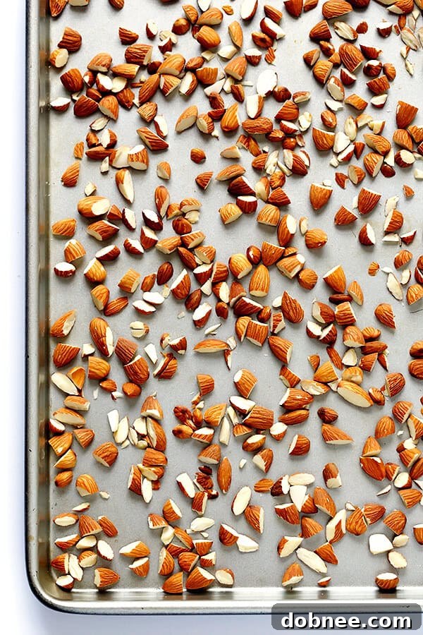 A bowl filled with raw Blue Diamond Whole Natural Almonds, ready for toasting and chopping for the Lemon Basil Spaghetti recipe. | gimmesomeoven.com