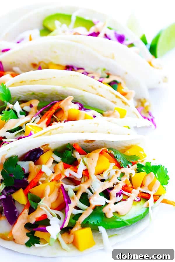 Colorful and fresh mango slaw with shredded cabbage, carrots, cilantro, and green onions, brightened with lime.