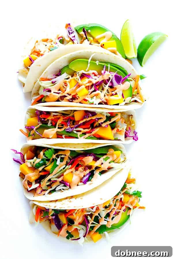 Delicious mango chipotle fish tacos arranged on a plate, ready to be enjoyed.