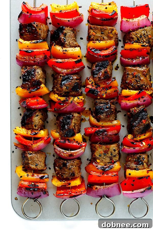 Delicious Korean Steak Kabobs: A super-easy, flavorful recipe with a simple marinade, grilled to perfection with bell peppers and onions. Enjoy this savory and tender steak dish! | dobnee.com