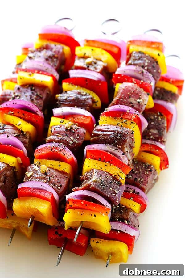 Flank steak marinating in a flavorful Korean sauce, ready for skewering. This recipe makes the most delicious grilled kabobs. | dobnee.com