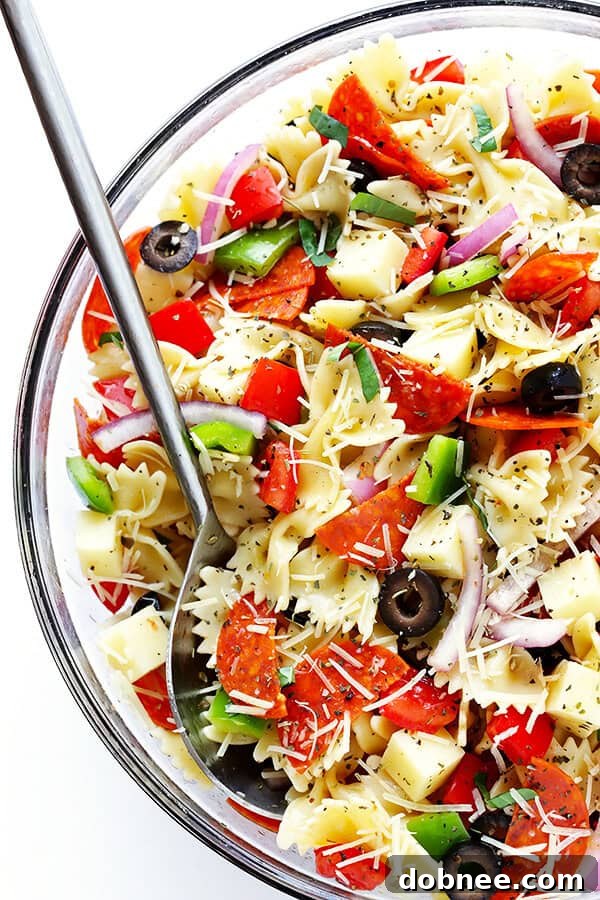 This vibrant Pizza Pasta Salad is quick to prepare, tossed in a zesty Italian vinaigrette, and fully customizable with all your favorite pizza toppings. Perfect for picnics and easy meals!