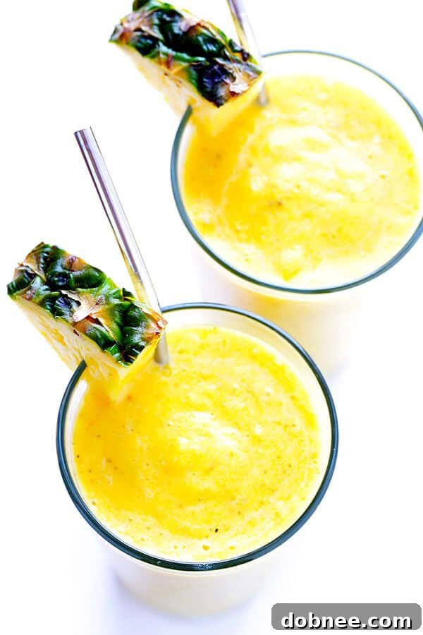 A high-powered blender is actively blending the smoothie ingredients into a smooth, creamy consistency.