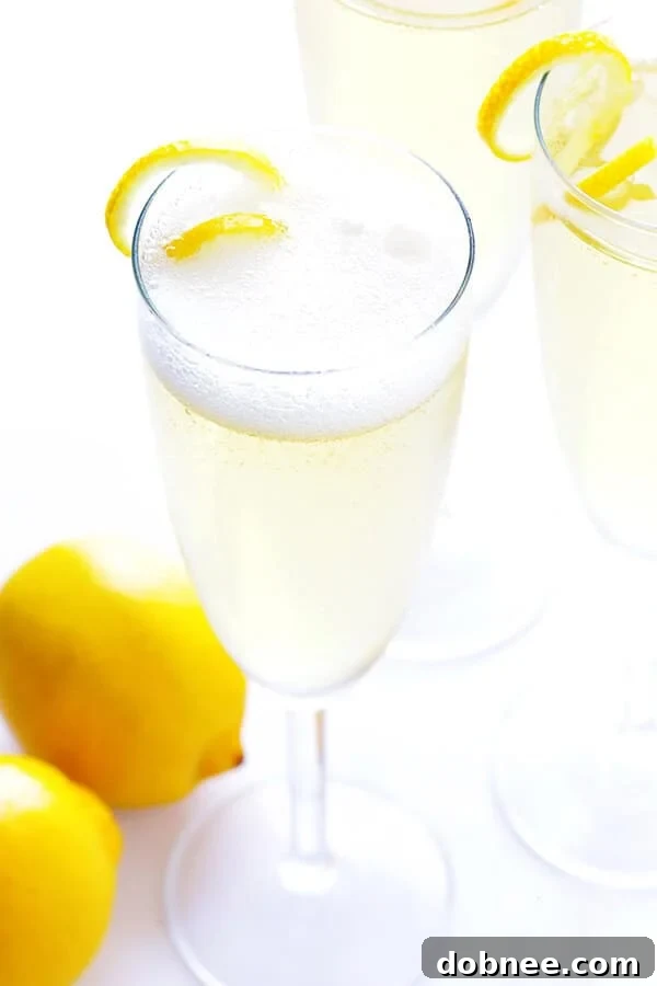 Classic French 75 cocktail with sparkling champagne, gin, fresh lemon juice, and simple syrup – perfect for celebrations.