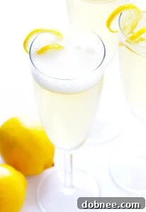 Classic French 75 cocktail with champagne, gin, lemon, and simple syrup.