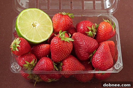 Homemade Strawberry Lime Yogurt Popsicles in molds, ready to be frozen