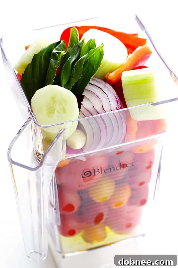 This 10-Minute Gazpacho Recipe is easy to customize with whatever veggies you have on hand, it's easy to make ahead of time, and it's absolutely delicious! Fresh tomatoes are the star of this easy gazpacho. | gimmesomeoven.com (Vegetarian / Gluten-Free)