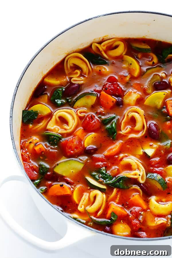 This Hearty Tortellini Minestrone recipe is bursting with fresh vegetables, elevated with delicious cheesy tortellini for the ultimate comfort food soup. A perfect blend of summer and fall flavors.