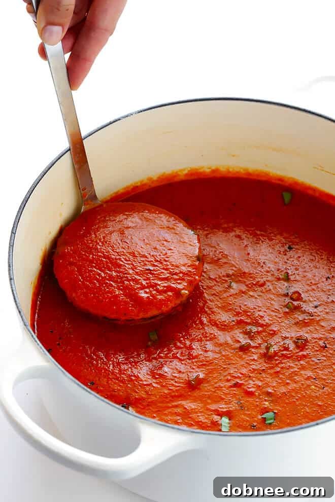 A finished pot of delicious 20-Minute Tomato Basil Soup, ready to be served, showcasing its vibrant color and smooth texture.