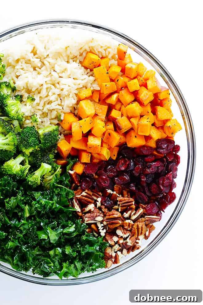 Tossing diced sweet potatoes with olive oil for roasting.