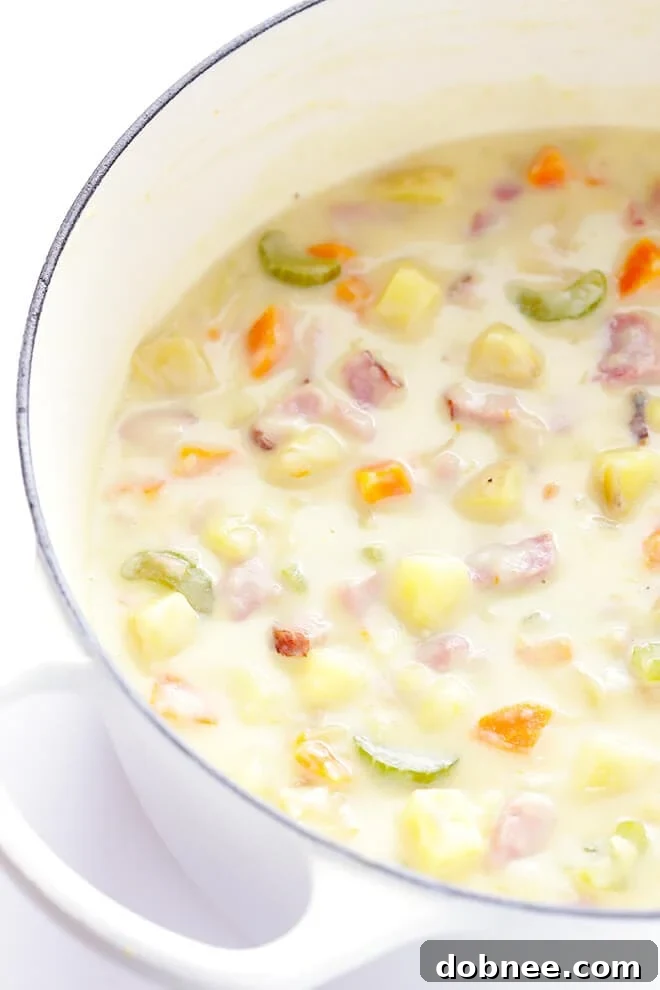 A close-up of the delicious, rich, and creamy texture of the ham and potato soup.