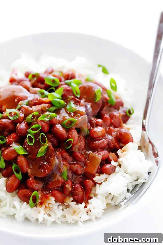 Hearty and flavorful slow cooker Creole Red Beans and Rice, perfect for a cozy meal. This easy recipe features tender red beans, savory Andouille sausage, and a rich blend of Creole spices, all cooked to perfection in a Crock-Pot.