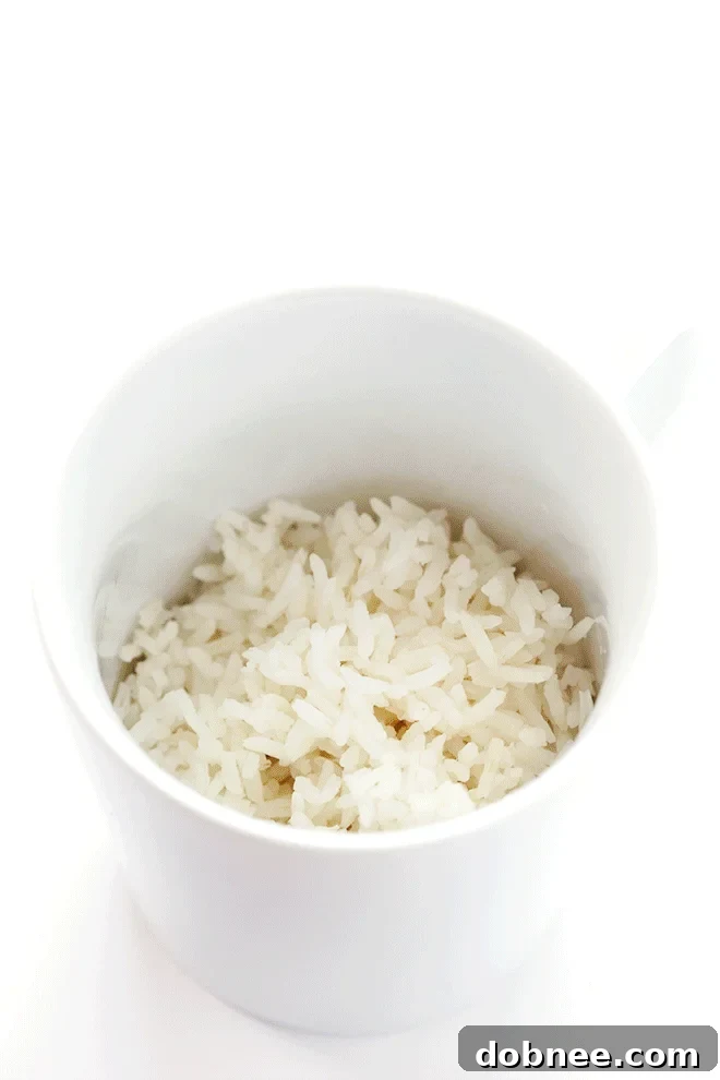 A close-up view of the creamy texture of the red beans and rice in the slow cooker, showcasing the blend of ingredients before serving.
