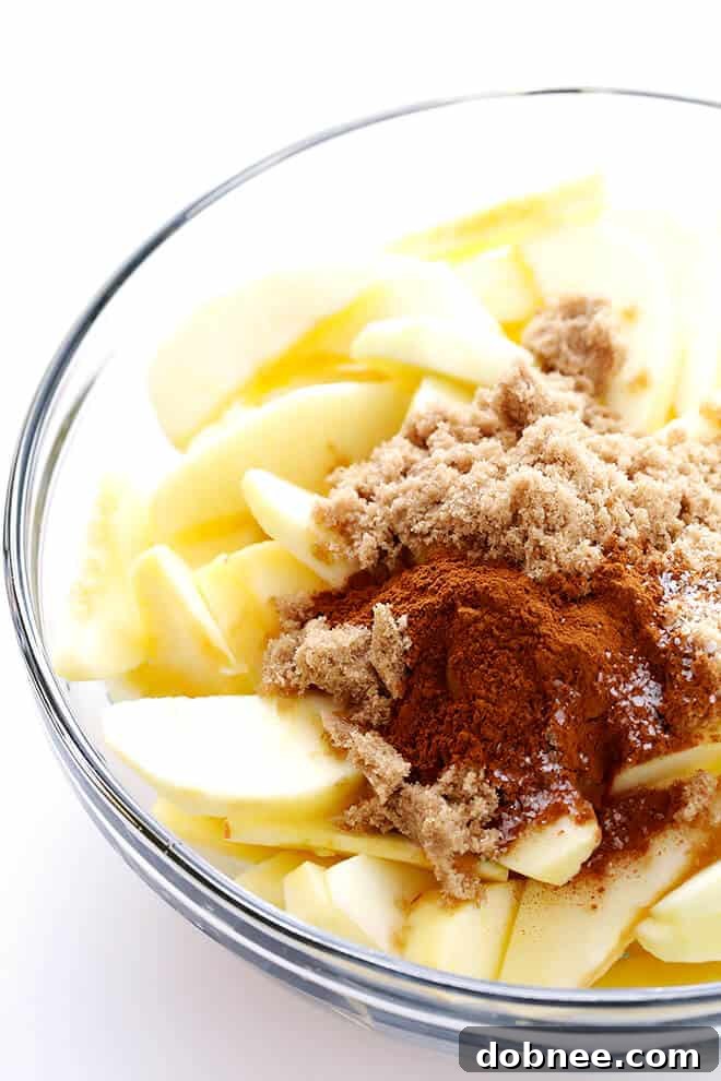 This Slow Cooker Apple Crisp features incredibly tender cinnamon apples and a perfectly crisp oatmeal-almond topping, all made effortlessly in your crock-pot.