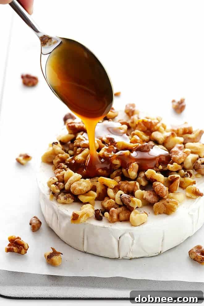 This 10-Minute Caramel Apple Baked Brie recipe is super-easy to make with just 3 ingredients, and it's the perfect appetizer for any party! | gimmesomeoven.com