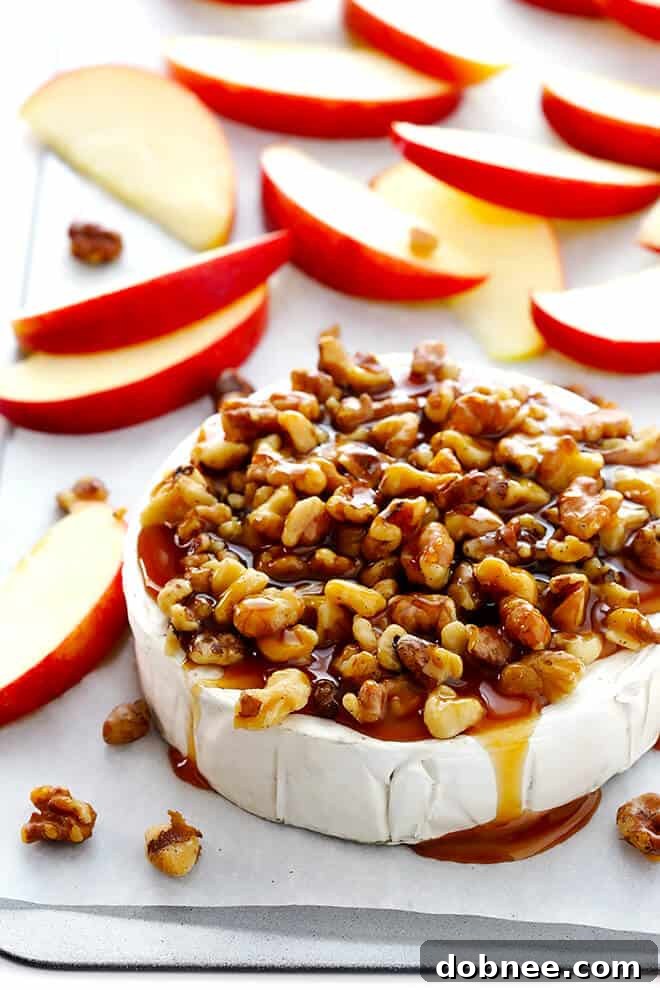 This 10-Minute Caramel Apple Baked Brie recipe is super-easy to make with just 3 ingredients, and it's the perfect appetizer for any party! | gimmesomeoven.com