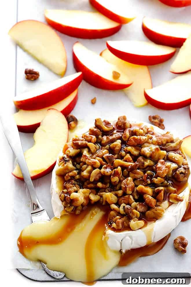 This 10-Minute Caramel Apple Baked Brie recipe is super-easy to make with just 3 ingredients, and it's the perfect appetizer for any party! | gimmesomeoven.com