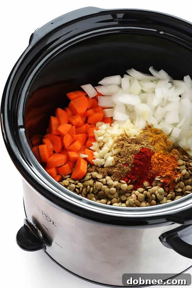A close-up shot of the hearty and healthy Slow Cooker Curried Lentil Soup, showcasing the rich colors and textures, perfect for a comforting vegan and gluten-free meal.