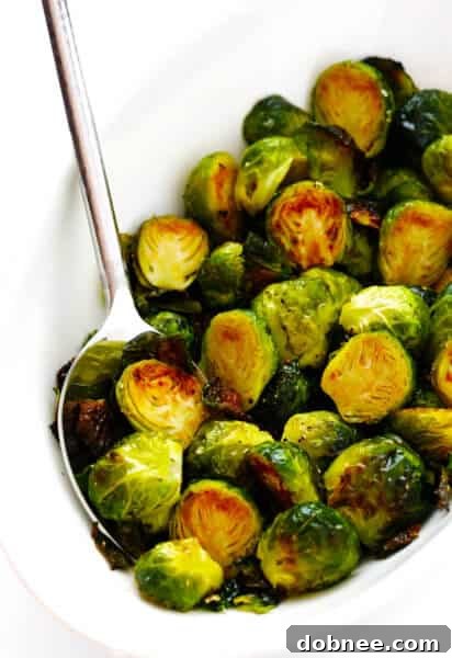 The ultimate recipe for roasted Brussels sprouts, featuring perfectly browned and crispy vegetables, ready to serve as a delicious side.