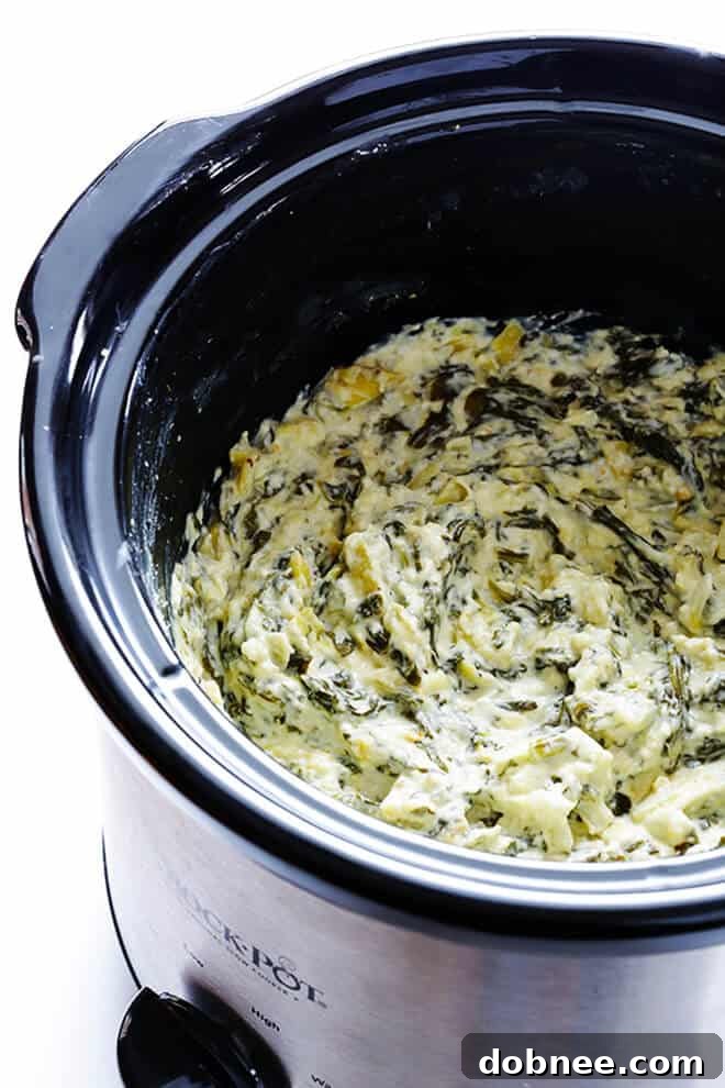 Creamy Slow Cooker Spinach Artichoke Dip, a lightened-up appetizer.