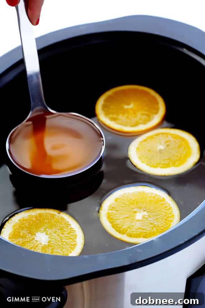 Aromatic Slow Cooker Apple Cider, perfect for holiday gatherings.