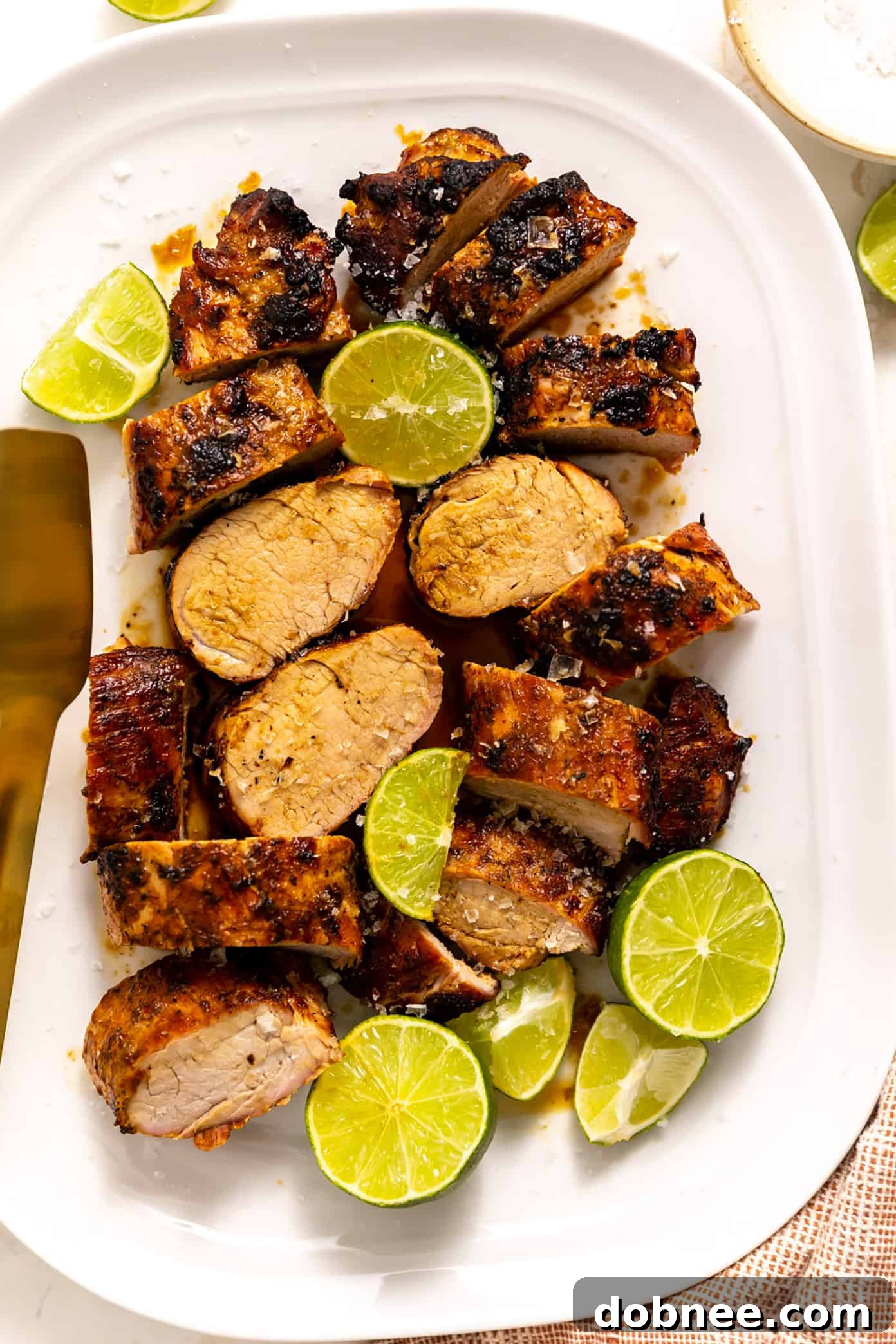 Zesty Ginger-Lime Pork Tenderloin 6 A vibrant close-up of the grilled ginger lime pork tenderloin, glistening and ready to serve