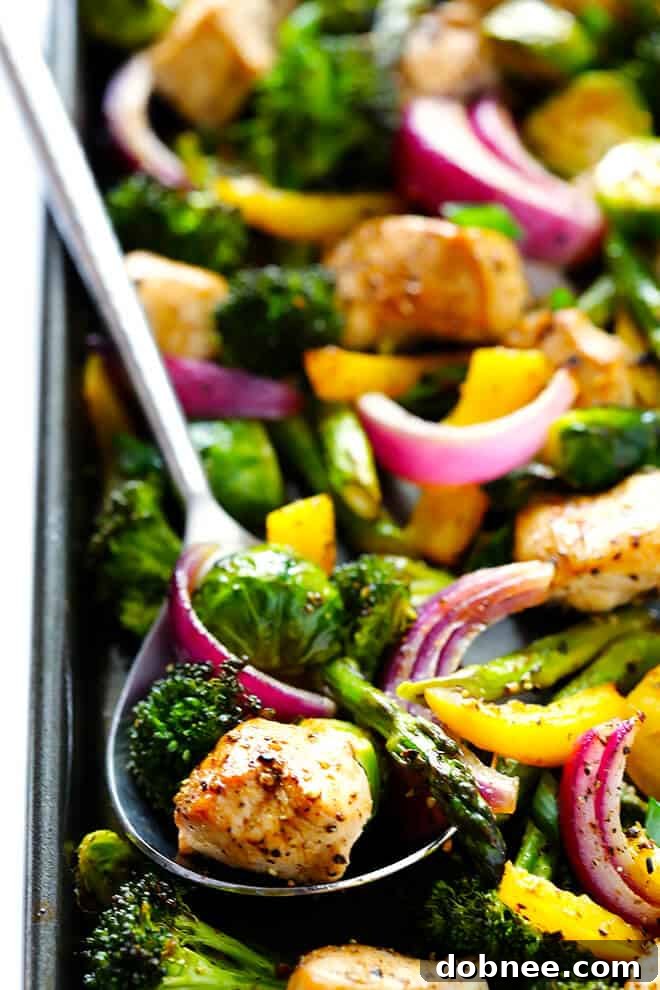 Sheet Pan Chicken and Veggies Stir Fry: A delicious, easy-to-prepare meal featuring tender chicken and roasted vegetables coated in a savory sesame-soy dressing, perfect for quick weeknight dinners and meal prep.