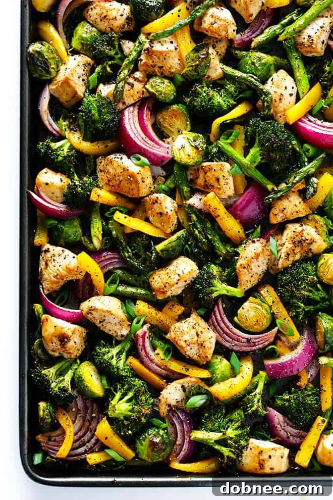 Preparing the Sheet Pan Chicken and Veggies Stir Fry ingredients on a sheet pan, showcasing fresh chicken pieces and colorful vegetables ready for roasting.