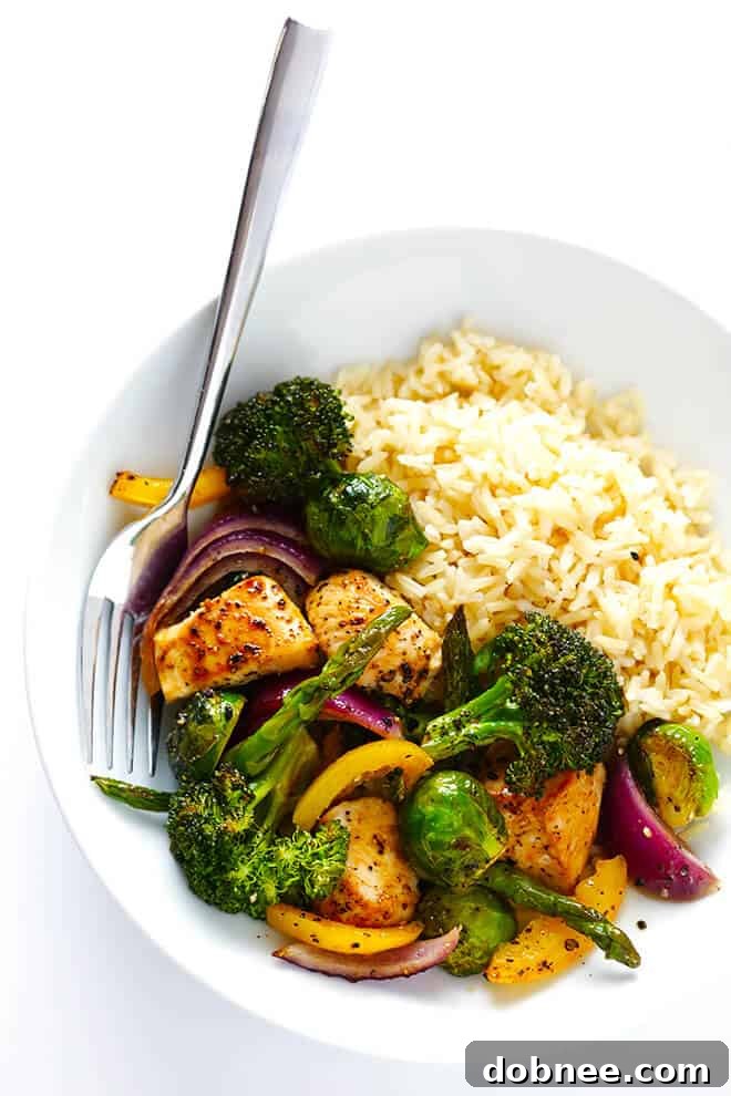 A close-up shot of the finished Sheet Pan Chicken and Veggies Stir Fry, featuring perfectly cooked chicken and a colorful medley of roasted vegetables, ready to be served.