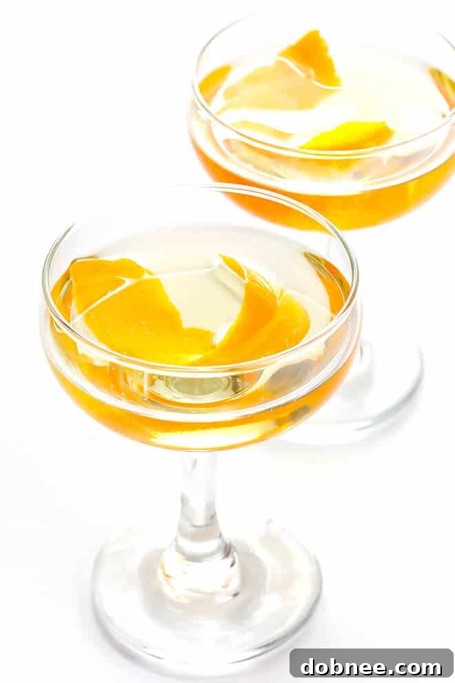 This easy cocktail is made with mezcal, Drambuie, orange bitters, jalapeno, and orange peel. The perfect blend of smoky, spicy, citrusy, and slightly-sweet -- so good!! | gimmesomeoven.com