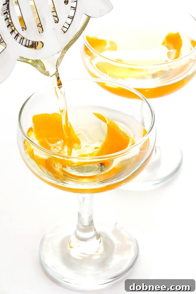 This easy cocktail is made with mezcal, Drambuie, orange bitters, jalapeno, and orange peel. The perfect blend of smoky, spicy, citrusy, and slightly-sweet -- so good!! | gimmesomeoven.com