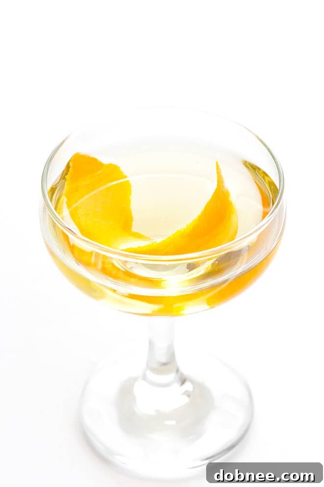 This easy cocktail is made with mezcal, Drambuie, orange bitters, jalapeno, and orange peel. The perfect blend of smoky, spicy, citrusy, and slightly-sweet -- so good!! | gimmesomeoven.com
