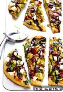 A perfectly baked Brussels Sprouts and Bacon Flatbread Pizza, garnished with balsamic glaze and fresh herbs.