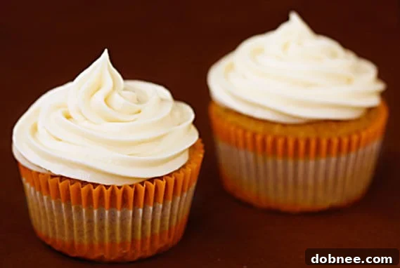 Delicious homemade carrot cupcakes topped with rich cream cheese frosting.