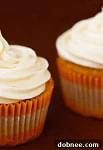 Beautifully frosted carrot cupcakes ready to be served, showcasing the rich cream cheese frosting.