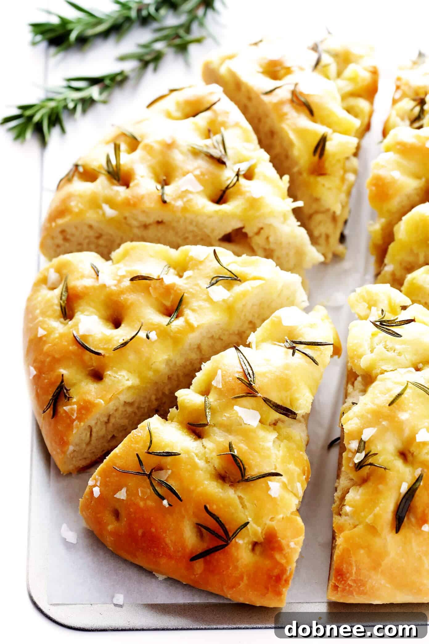 Delicious Homemade Rosemary Focaccia Bread Recipe with fresh rosemary, olive oil, and flaky sea salt