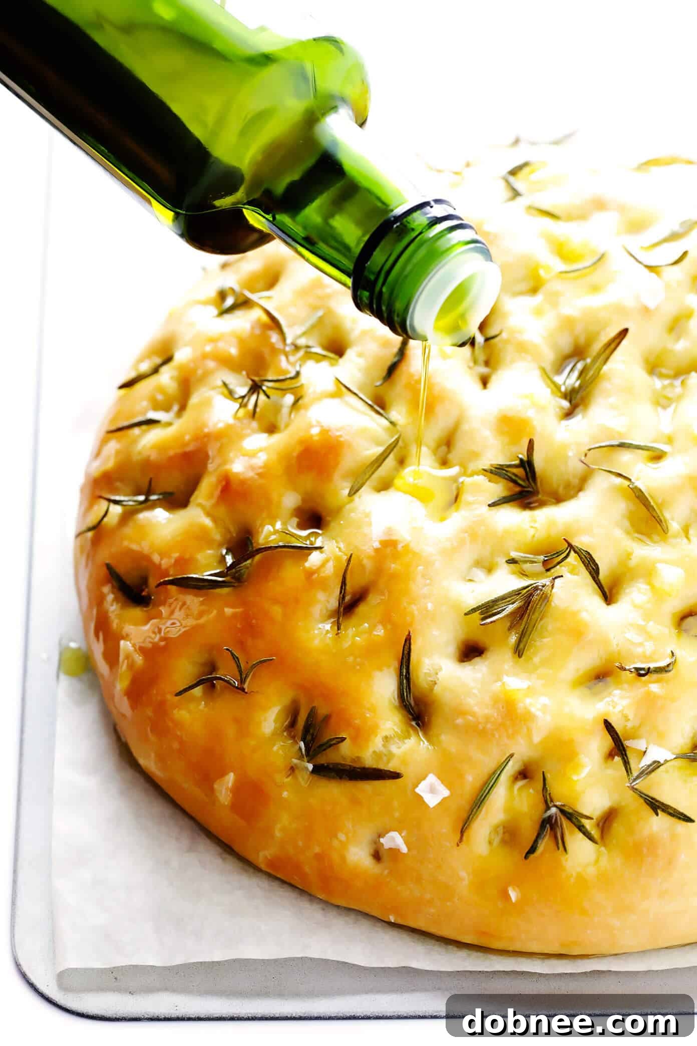 Close-up of baked focaccia bread showing texture and toppings