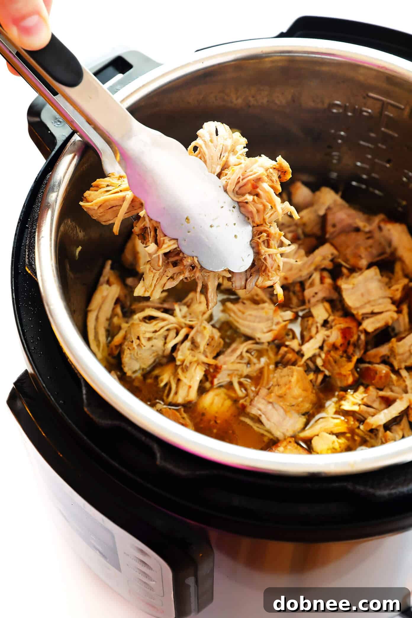 Instant Pot Pork Carnitas - Juicy, tender pork cooked with a garlic citrus mojo, then broiled for a crispy finish.