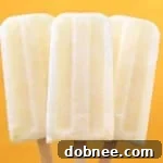 Creamy Lemon Popsicles on a tray.