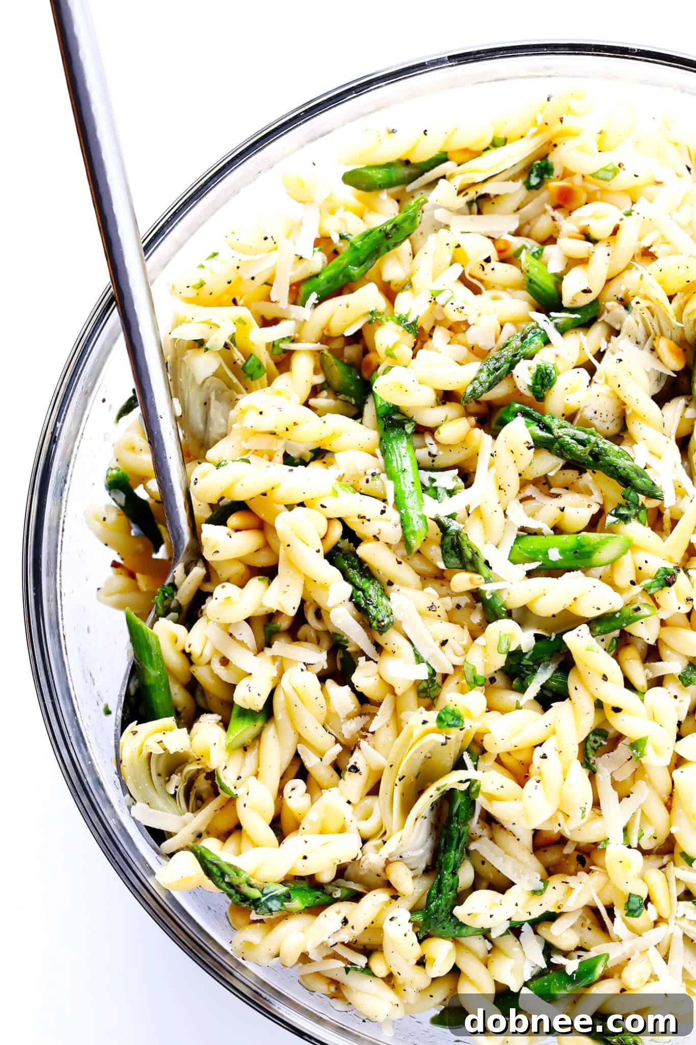 This Lemony Artichoke Pasta Salad recipe is quick and easy to make ahead, tossed with a delicious lemon-basil vinaigrette, and perfect for a picnic or porluck! It's a fantastic side dish for any gathering.