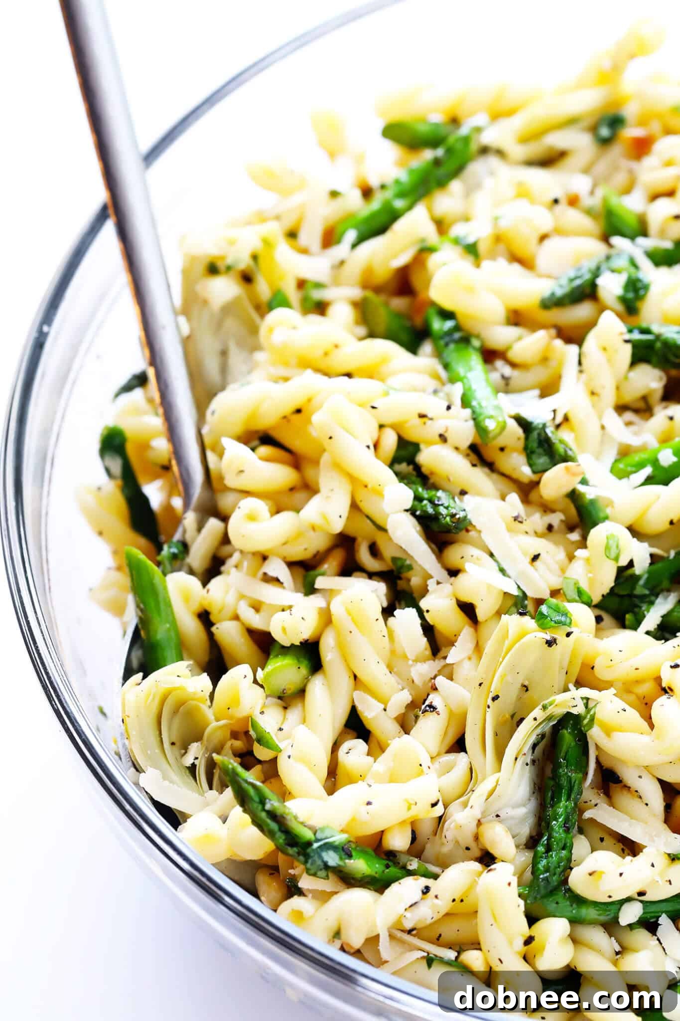 This delicious Lemon Artichoke Asparagus Pasta Salad is super simple to make, and full of the best fresh spring flavors! A vibrant, healthy, and satisfying dish.