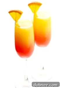 Tequila Sunrise Mimosa in a champagne flute with an orange slice garnish, recipe card image.
