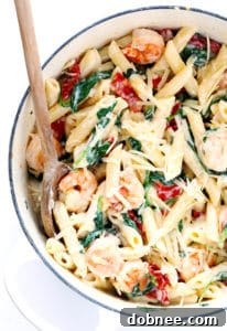 Creamy Shrimp Florentine Pasta with sun-dried tomatoes, spinach, and basil