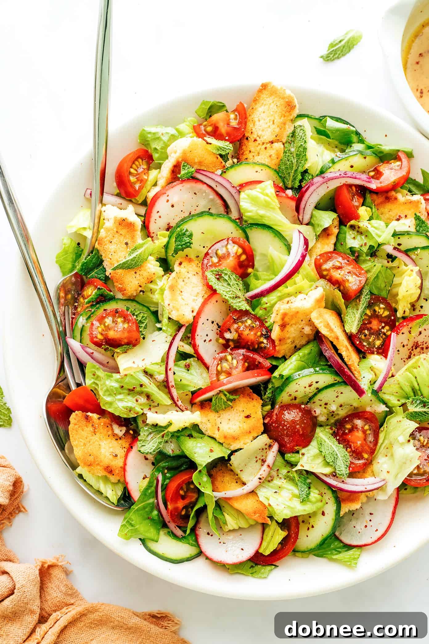 Refreshing Fattoush Salad 2 Fattoush Salad served in a large bowl, showcasing its vibrant fresh ingredients and crispy pita chips.