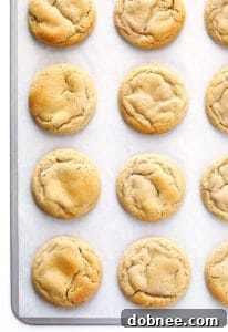 Soft and chewy chipless cookies stacked on a plate.