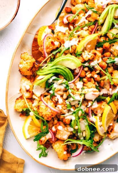 Roasted Cauliflower, Chickpea and Arugula Salad with tahini dressing